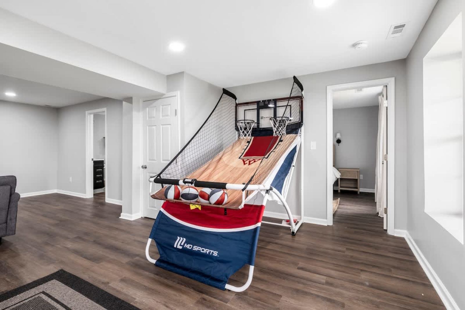 Indoor double-shoot arcade basketball game in the lower-level rec room